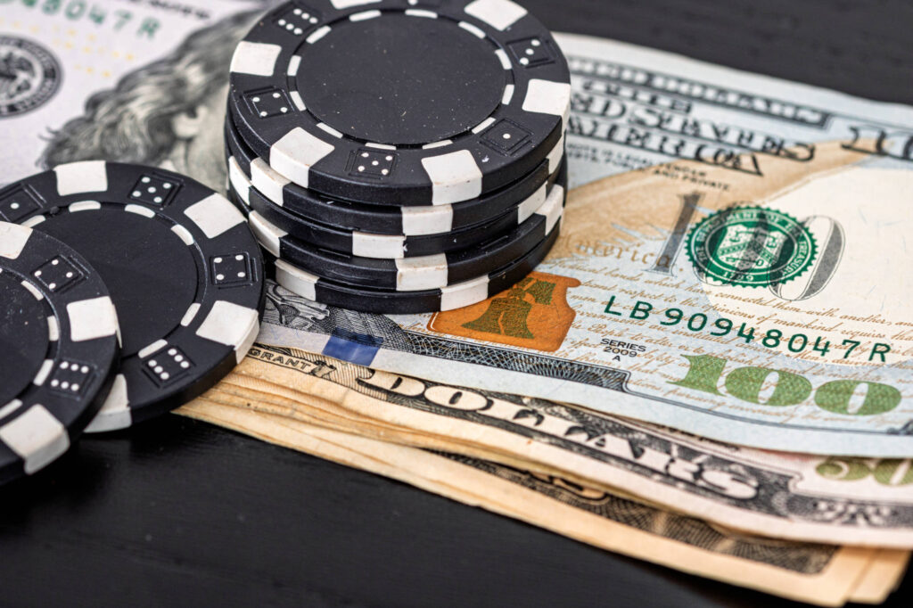 Stacks of poker chips on money